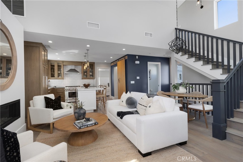For those who appreciate elevated design and effortless living, this rear townhome in the heart of Corona del Mar offers a rare opportunity to own a modern coastal retreat with cosmopolitan flair. This thoughtfully crafted 2-bedroom, 2.5-bath residence captures the essence of a chic city flat—clean lines, refined finishes, and a calm, curated ambiance. Yet, outside your door awaits the relaxed charm of village life and the beauty of Southern California’s coast. Designed with intentionality and flair, the interior showcases soaring vaulted ceilings, wide-plank wood floors, custom cabinetry and premium fixtures creating a refined yet comfortable backdrop for everyday living. The open-concept great room and chef’s kitchen are tailor-made for both relaxed evenings and stylish entertaining, with high-end appliances, stone countertops, and an effortless flow to the private outdoor patio.
A highlight is the expansive rooftop deck with built-in bbq and refrigerator, perfect for enjoying ocean breezes and glowing sunset views—your own private perch above the Village.Additional highlights include laundry area, an attached one-car garage, and an extra carport.
Just moments from world-class dining, boutique shopping, and the sparkling coastline, this home is turn-key, effortlessly cool, and truly one of a kind.