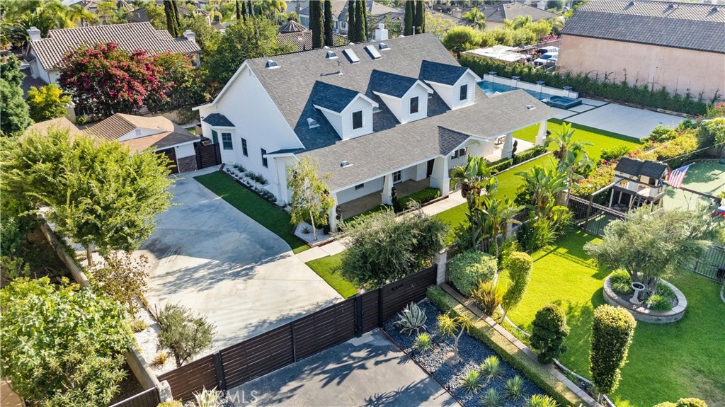 Ready to fall in love? The one you've been waiting for is finally here. This one of a kind, 2012 custom built Modern Craftsman is truly timeless and effortlessly attractive. The symmetrically gabled roof lines, the wrap around porch, and the tapered columns seamlessly integrate into a stylish and functional layout with soaring ceilings, 8 foot doorways, and a gorgeous kitchen with walk-in pantry and luxury designer appliances. The floorplan includes 4 first floor bedrooms, an additional home office, plus an expansive upstairs loft with the option to add additional bedrooms into the 300+ sqft attic space. It sits on over a half acre of flat usable yard space with NO HOA and has a newly built sparkling pool with lighting, water falls, and glass tiling. There is also concrete building pad that is pre-plumbed for a covered outdoor kitchen in addition to the low maintenance landscaping. There is excellent privacy & security behind the automatic property gates. The schools are all exceptional, shops & restaurants are conveniently nearby. Don't forget the 3 car finished garage with epoxy flooring and cabinetry, EV charging outlets, and fully paid off solar panels. The value is incredible, the home is unforgettable.