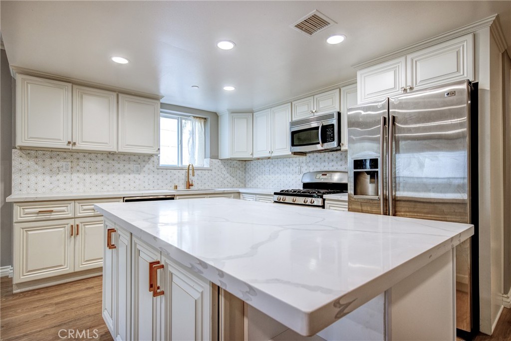 Rare GATED three bedroom, two full bath unit on the first floor (third floor of the building) with a balcony, video intercom, and several guest parking spaces inside the complex! COMPLETELY REMODELED in 2018 with new paint, smart home switches, 20+ extra recessed lights installed, brand new waterproof flooring, remodeled bathroom, and cabinet upgrades. It is conveniently located in the heart of Korea town, walk-able distances to several markets, restaurants, and public transportation. Gorgeous home! Bring your picky tenants! Rent INCLUDES water and trash!!