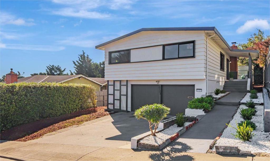Welcome to 2731 Maywood Drive, a beautiful home nestled in the highly desirable Rollingwood neighborhood of San Bruno. This light-filled residence offers a perfect blend of comfort and convenience with an inviting floor plan designed for modern living. The main level features a spacious living room with large windows, hardwood floors, and a cozy fire place ideal for relaxing or entertaining. The light-filled kitchen flows seamlessly into the dining area. Three comfortable bedrooms and two bathrooms complete the main level. The lower level offers additional versatility with a bonus room/office, laundry room, and access to the backyard perfect for guests, a home gym, or work-from-home space. Step outside to a private backyard retreat with a patio, providing the ideal setting for outdoor dining, gardening, or play. Located just minutes from top-rated schools, parks, shopping, dining, and easy freeway/BART access, this home combines suburban tranquility with urban convenience. San Bruno is next door to the Worlds Biotech Hub. Minutes from Genentech, YouTube, and SFO San Bruno Has It All.