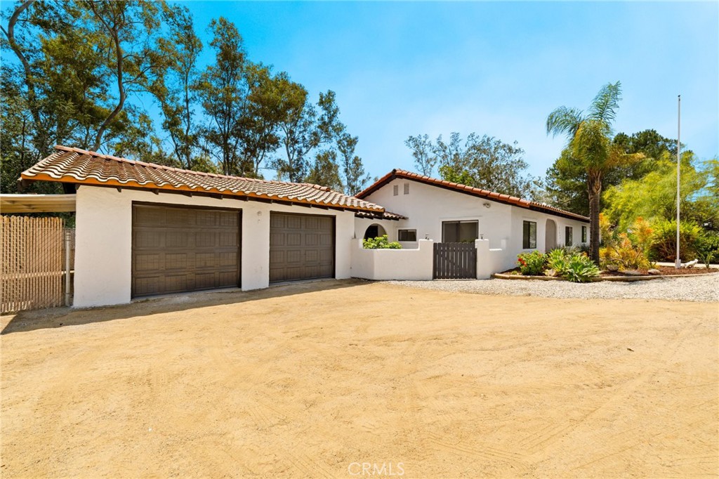 21885 Lake Mathews Dr, Perris, CA 92570 4 Bedrooms | 2 Bathrooms | Approx. 2,584 Sq Ft | ~2.92 Acres
Discover the perfect blend of rustic charm and modern luxury in this beautifully renovated ranch-style home, nestled on nearly 3 acres of serene, usable land just minutes from the tranquil shores of Lake Mathews.
OVER $280,000 in renovations!
Interior Highlights:
Spacious open-concept living area with abundant natural light, ideal for both relaxation and entertaining.
Gourmet kitchen featuring brand-new quartz countertops, custom cabinetry, and state-of-the-art stainless steel appliances.
Four generously sized bedrooms, including a master suite with a spa-like bathroom and walk-in closet.
Two fully remodeled bathrooms showcasing modern fixtures, elegant tile work, and designer finishes.
Newly installed wood flooring throughout, complemented by fresh interior and exterior paint.
Upgraded HVAC system, and electrical panel for peace of mind.
Exterior Features:
Expansive nearly 3-acre lot offering endless possibilities for outdoor activities, gardening, or future development.
Attached 2-car garage with new doors and ample storage space.
Private breezeway connecting the main house to the garage, enhancing both functionality and aesthetic appeal.
Scenic backyard with built-in BBQ and patio area, perfect for hosting gatherings or enjoying quiet evenings.
Mature landscaping providing natural privacy and a tranquil setting.
Prime Location:
Situated just 0.5 miles from Lake Mathews, this property offers the tranquility of rural living with convenient access to urban amenities. Only 15 minutes to The Crossings at Corona and 19 minutes to Dos Lagos, placing shopping, dining, and entertainment within easy reach.
Additional Information:
Building permits not found; buyer to verify all information.
No HOA fees, providing greater flexibility and freedom.
This home is a rare find—combining spacious living, modern upgrades, and a prime location. Whether you're seeking a peaceful retreat or a place to entertain, this property offers it all.