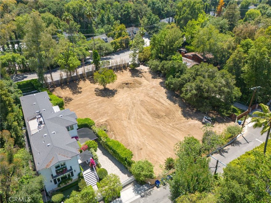 Build your dream home today! This rare shovel-ready opportunity sits on a large 25,293 sf lot with an adjacent paper street parcel of 7,200 sq ft offering up to 32,493 sq ft of usable space. Perfectly positioned on a picturesque, tree-lined street just across from Fryman Canyon and within the top-rated Carpenter School District. There are approved plans included for two homes one for 6,636 sq ft and the second for 6,333 sq ft modern farmhouse in the quiet, celebrity-studded Studio City Hills. All city clearances done – no haul route, no caissons, gentle 5% slope. Save years of notorious permitting delays – just pull the permit and build. The included plans feature a thoughtfully designed open-concept floor plan with a spacious lower level basement and spaces designed for effortless entertaining. Don’t miss this opportunity to build your dream home in one of LA’s most desirable neighborhoods. Seller financing is available.