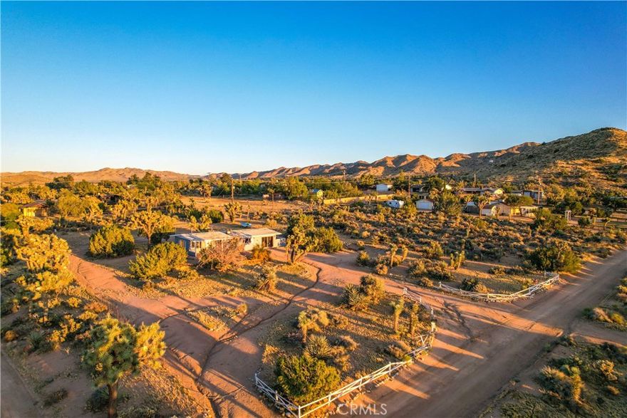Vintage block-style mid-century sweetie!  Perched high in South West Yucca Valley, this historic acreage & view home is a creative person's blank canvas. Surrounded by ancient Joshua Trees with a majestic mountain backdrop creates the magic for this rare and desirably hip masonry home! Ideal location--rural living but just down the street from old town Yucca Valley with its fun cafes and coffee houses, antique shops, art galleries &  boutique merchants, and a quick drive to some fantastic hiking spots plus a short drive to the always fun Pioneertown. Needs a person with vision and construction talents to finish. The property is a 1951 build 2-bedroom 1-bathroom 1222 sq feet according to public records, with a 1.25 acre view lot. The masonry build is a rare find--highly sought after but finally the opportunity is here! The original design lends itself to bringing in lots of natural lighting as well as windows positioned to take advantage of the great views. Water connected and 200-amp electrical service panel completed. Own a home with history..come see today!