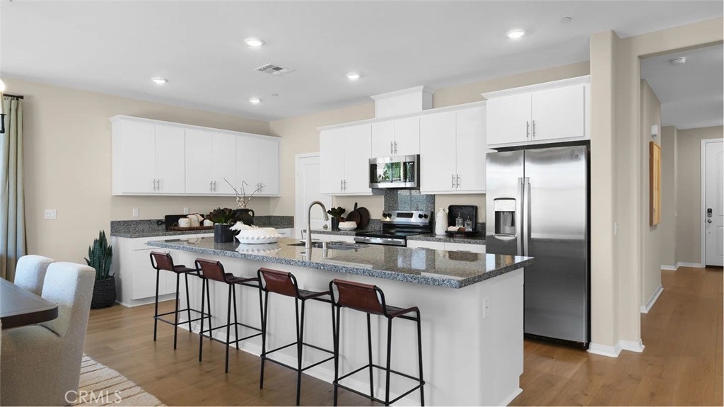 NEW CONSTRUCTION! Ready for Quick Move-in! This new two-story home features an inviting open-concept layout on the first floor, blending the kitchen, living and dining areas for simple transitions and multitasking, and a bedroom and full bathroom are secluded off the foyer. On the second floor, a versatile loft provides a shared living space easily accessible from three bedrooms and a luxe owner’s suite, complete with a full bathroom and walk-in closet. The kitchen features new caledonia granite counters and white cabinetry.
Estrella is a gated community of brand-new single-family homes for sale, coming soon to Moreno Valley, CA. Residents will enjoy access to onsite amenities, including a pocket park with shade structures, a tot lot and BBQ area. Estrella is located near the March Air Reserve Base, perfect for military families and personnel. Head over to the Lake Perris State Recreation Area to enjoy the outdoors, with opportunities to boat, hike and more, or enjoy endless recreation options at nearby Lasselle Sports Park.