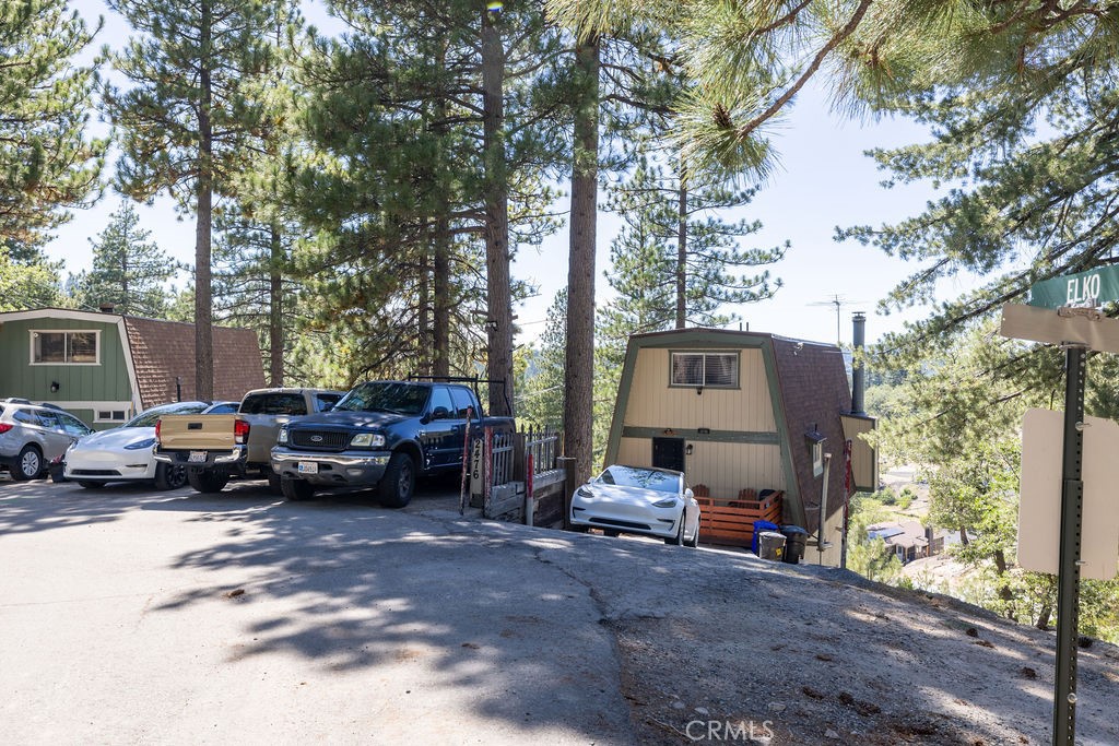 Mountain Retreat on a Hilltop with Breathtaking Views| Large lot :8,805 Sq $Possible income potential as it has lower level Room with its own entrance $ .
Potential | EV Ready | Fully Furnished | RV/Boat Parking | Generator Equipped
Welcome to your dream mountain getaway, perched atop a scenic hill between Big Bear Lake and Lake Arrowhead — offering year-round adventure, stunning views, and a unique investment opportunity!
This one-of-a-kind retreat blends comfort, function, and flexibility, making it ideal for personal use, extended stays, or a profitable Short-Term Rental.
Highlights You’ll Love:
Breathtaking panoramic views from two oversized balconies
Second private entrance on the lower level with a bathroom— perfect for a guest suite, ADU, or extra income
Fully furnished – ready to move in or rent out immediately
Generator hookup in place – reliable backup power with a simple, stress-free connection
EV charging station (50amp) for modern convenience
RV/Boat parking (fits 30–40 ft) + 3 extra flat-level parking spaces – a rare mountain find!
Expanded 8,800+ sq. ft. lot formed from exclusive merged parcels
Recent Upgrades Include:
Newly remodeled kitchen & bathrooms
Brand new bathroom on lower level
Modern EV charging infrastructure
Freshly constructed storage shed
Updated systems and finishes throughout
The Lifestyle:
Enjoy four true seasons and a vibrant mountain community with:
Nearby hiking, off-roading & horseback riding trails
Fishing, swimming & boating at Lake Arrowbear
Easy access to seasonal snow play & year-round outdoor fun
A welcoming small-town spirit surrounded by nature
This turnkey property is your chance to own a rare blend of location, amenities, and versatility. Whether you're seeking a peaceful sanctuary, multi-generational layout, or a smart investment—this home checks all the boxes.
Don’t wait—opportunities like this don’t last. Schedule your private showing today!