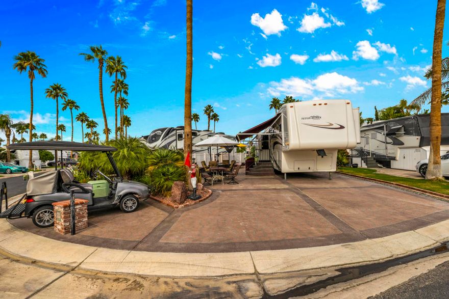 Experience one of the most exceptional RV lot packages at Outdoor Resort Palm Springs. Perfectly positioned on an oversized corner lot along the golf course and overlooking a stunning double-fountain lake, this property offers unmatched beauty, privacy, and space.The package includes an immaculate 2006 Teton--one of the nicest you'll find--featuring a washer, dryer, and gorgeous picture-perfect views right out the back toward the lake. The outdoor areas are fully furnished and beautifully arranged to take full advantage of the sweeping water and fairway vistas, creating effortless indoor-outdoor living.This is a turnkey opportunity--furnished inside and out--and an ideal retreat for those who want a premium lot in one of the desert's most desirable five-star RV resorts. Truly a spectacular setting, move-in ready, and a rare offering in ORPS.Outdoor Resorts Palm Springs is a Five Star RV Resort Community combining luxury with affordability. It is a guard gated resort that sits on 137 beautifully landscaped acres with 27 holes of executive golf, 10 tennis courts, 13 pickleball courts, 8 swimming pools, a fully equipped fitness center, sports bar, beauty salon/barber shop, full-service restaurant, 2 club houses, activities, special events and so much more.