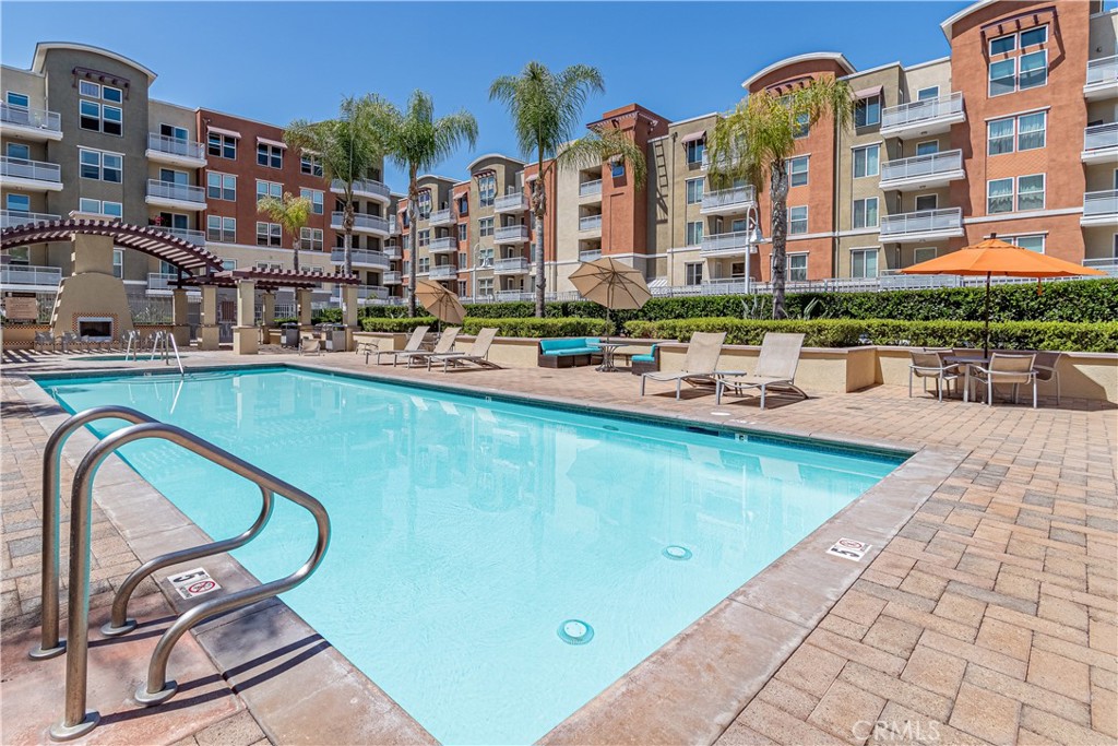 Enjoy Urban Metro mid-rise living in Garden Grove. Come home, kick off your shoes, stream your favorite Netflix or relax at the pool / spa at the Chapman Commons -- Garden Grove's playground. Surrounded by shopping and fine dining, it is no reason why this is the best place to call home. Within walking distance to Target, Joe's Crab Shack, Starbucks, Outback and Red Robin and minutes from UCI Medical Center, DISNEYLAND, HONDA CENTER, ANGEL'S STADIUM, soon to be OC LIVE!!, Santa Ana riverbed (for those cycling enthusiasts) and the ARTIC station, you are near the mecca of entertainment in OC. Enjoy a wonderful open floorplan featuring 3 bedrooms and 2 baths, hardwood floors in the living and dining room areas and carpet in the hallway and bedrooms. Interior washer and dryer is included. Enjoy views of the tall palms, birds of paradise, courtyard and soothing water fountain. Enjoy serene tranquility in this HOT spot. This home will not last long and this particular footprint is rarely on the market and high in demand. Amenities within Chapman Commons include pool, spa, BBQs, outdoor fireplace, fitness center, club house, poker room and more. Landlord pays for HOA fees which include TRASH, WATER and GAS. 3 assigned side-by-side parking spaces also included. Come see this fabulous unit and call it Home today!!! Available first week of August 2025. Call and schedule your private showing today!