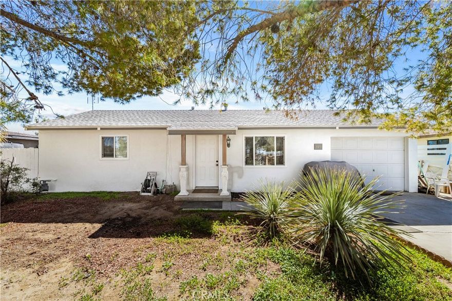 **Welcome to this beautifully remodeled 2-bedroom, 1-bath home offering 720 sq. ft. of stylish living space.** Every detail has been thoughtfully updated inside and out. Fresh exterior and interior paint give the home a clean, modern look, while an upgraded fence fully encloses the property for added privacy. A new oversized enclosed patio with two wall A/C units expands the home’s livable space, providing year-round comfort.

Step into the large backyard retreat, designed for both relaxation and entertaining. Enjoy low-maintenance turf landscaping, a custom stone patio slab, decorative landscape lighting, and two stunning waterfalls that create a serene ambiance.

Inside, upgrades shine with new laminate flooring, trim, and baseboards throughout. All-new vinyl dual-paned windows and sliding glass doors bring in natural light while improving energy efficiency. The kitchen features granite countertops, resurfaced cabinetry, and a fresh modern feel. The bathroom has been completely remodeled with decorative tile, an upgraded vanity, new toilet, and a sleek shower glass door.

This move-in ready home is truly turnkey—perfect for those who appreciate quality upgrades, stylish finishes, and a relaxing outdoor space.