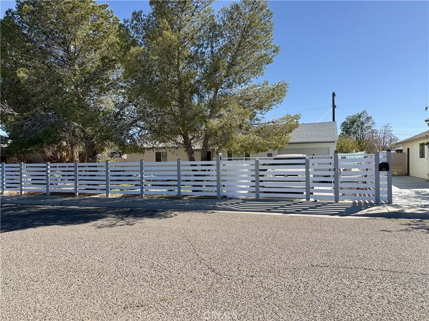 **Welcome to this beautifully remodeled 2-bedroom, 1-bath home offering 720 sq. ft. of stylish living space.** Every detail has been thoughtfully updated inside and out. Fresh exterior and interior paint give the home a clean, modern look, while an upgraded fence fully encloses the property for added privacy. A new oversized enclosed patio with two wall A/C units expands the home’s livable space, providing year-round comfort.



Step into the large backyard retreat, designed for both relaxation and entertaining. Enjoy low-maintenance turf landscaping, a custom stone patio slab, decorative landscape lighting, and two stunning waterfalls that create a serene ambiance.



Inside, upgrades shine with new laminate flooring, trim, and baseboards throughout. All-new vinyl dual-paned windows and sliding glass doors bring in natural light while improving energy efficiency. The kitchen features granite countertops, resurfaced cabinetry, and a fresh modern feel. The bathroom has been completely remodeled with decorative tile, an upgraded vanity, new toilet, and a sleek shower glass door.



This move-in ready home is truly turnkey—perfect for those who appreciate quality upgrades, stylish finishes, and a relaxing outdoor space.