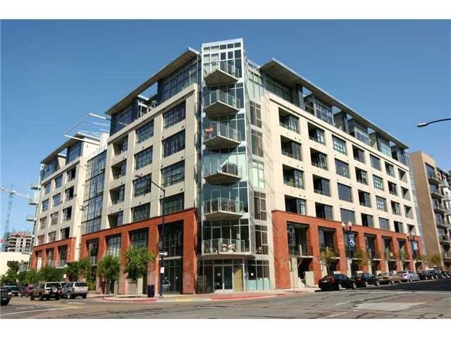 Very cool, urban loft on 6th floor at the highly desirable M2i in East Village. Hardwood flooring throughout and a half wall separating the bedroom from the living space. Private patio with views facing out to the city. South facing orientation provides lots of light. Custom closet build out and additional closet by the door for plenty of storage space. Walkable location close to all. 1 parking space included in underground garage. Building amenities: fitness center and 7th floor roof deck with BBQ. Neighborhoods: East Village Complex Features: ,, View: City,Evening Lights