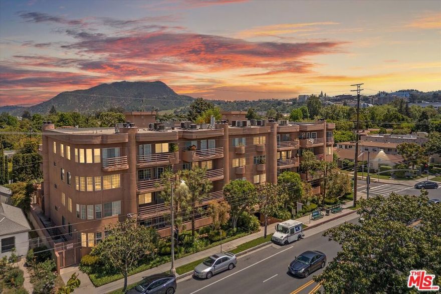 Welcome to a spacious and beautifully designed corner unit in the heart of Toluca Lake. This 2,484 square foot condo offers two bedrooms plus a versatile third room that works perfectly as a den, office, or guest bedroom, along with two and a half bathrooms. The open layout is filled with natural light and features scenic views of treetops and mountains from the living and dining areas. A cozy fireplace anchors the space, making it ideal for relaxing or entertaining guests. The kitchen includes a breakfast bar, a walk-in pantry, with direct access to a large balcony that's perfect for outdoor dining or lounging. The expansive primary suite is a true retreat, complete with its own fireplace, a large walk-in closet, balcony access, and a spacious en suite bathroom with a jetted tub and separate shower. The second bedroom also features an en suite bath for added privacy and convenience. Additional highlights include dual-pane windows, Central AC/Heat, in-unit laundry, plantation shutters, and tasteful upgrades throughout. This well-maintained condo community offers a pool, spa, elevator, secure entry, side-by-side parking, and secure storage space. Located in one of LA's most desirable neighborhoods, this condo is just steps from the best of Toluca Lake. Enjoy top-rated dining at Ca' Del Sole, Verse, The Front Yard, grab a bite at Easy Street Burgers, or golf at Lakeside Country Club. You're just minutes from Universal Studios, the shops and cafes on Ventura Boulevard, and have quick access to the 134, 101, and 170 freeways. Whether you're commuting to the studios or exploring local parks and trails, this is where comfort meets convenience in style.