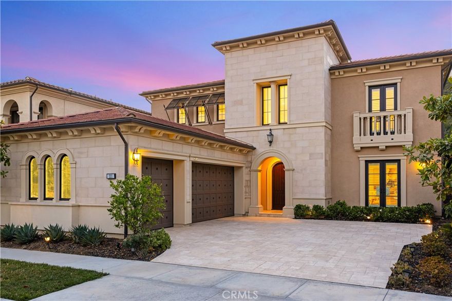Sited in one of Irvine’s most prestigious communities, this beautifully designed home offers a seamless blend of luxury, functionality, and privacy. Set on a quiet street within the 24-hour guard-gated Groves of Orchard Hills, the property enjoys access to top-rated schools and exclusive resort-style amenities including a pool, clubhouse, tennis courts, scenic parks, hiking trails, and year-round community events.

Upon entering, you’re welcomed by an impressive grand foyer with soaring ceilings, a statement spiral staircase, and an elegant chandelier, all setting a refined yet modern tone. The expansive layout includes a large, light-filled loft with recessed lighting and windows—ideal for a second living area or creative space.

Designed with both everyday living and entertaining in mind, the home features a flex office space, two separate garages, and a chef-caliber kitchen complete with a walk-in pantry, prep kitchen, oversized island with breakfast bar, and premium stainless steel appliances.

The primary suite boasts a luxuriously updated walk-in closet and a spa-inspired bath with a large all-glass steam shower, soaking tub, and expansive his-and-her vanities. Updated flooring and crisp white walls throughout the home enhance its brightness and clean elegance.

The private backyard offers a peaceful retreat, while every detail in the home— including added square footage and designer finishes—reflects thoughtful upgrades and modern design.

A rare opportunity to own a move-in ready, elevated home in one of Irvine’s most sought-after locations—surrounded by fine dining, serene landscapes, and a vibrant yet peaceful community.