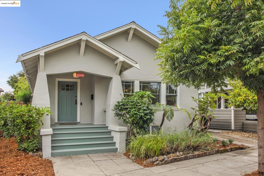 Imagine yourself in this charming 2-bedroom, 1-bath Temescal bungalow! Step inside to discover beautiful hardwood floors, wainscoting, built-ins, and a stone fireplace in the living room, all of which remain true to the original character and warmth of homes in this desirable North Oakland neighborhood. The living space exudes charm, with the living and dining rooms bathed in natural light. The sunny kitchen, equipped with new appliances, has everything you need to create your next culinary masterpiece. Updated double-paned windows, a basement for extra storage, and a fenced backyard for gardening and entertaining add to the core functionality of this home. With a Walk Score of 93 and a Bike Score of 98, daily errands and outings are a breeze. Nearby, you'll find local favorites like Bakesale Betty, Pizzaiolo, Burma Superstar, and Doña, along with the boutiques and cafés of Temescal Alley. The MacArthur BART Station is less than a mile away, offering quick access to San Francisco and beyond. Nearby schools, including Park Day School and Oakland Tech, add to the appeal. This is a home that blends classic character with a location that makes everyday living easy.