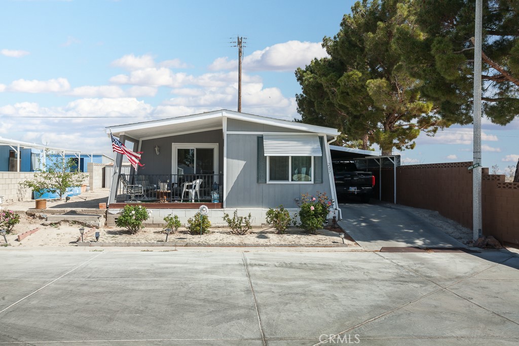 This charming Lancaster cottage is tucked into the Leisure Lake mobile home senior community – an oasis in the desert! The lake is populated with all sorts of water birds and all the Spring babies have just been born! This 2 bedroom 1 bathroom home is cozy and not a spare inch goes to waste! There’s a patio out front, perfect for enjoying mornings or early evenings outside where you can wave to your neighbors – and the ducks and geese who wander by! The current owners have completed many improvements and upgrades since owning the home, including new windows & sliding doors, a new roof, new plumbing, fresh paint and more. The living room includes an alcove perfect for a desk and the dining area has a sliding door that opens to the front patio. The efficient kitchen features a peninsula with room for seating and solid surface counters and the bathroom includes and tub/shower combo and lots of storage! There’s a sizable yard area in the back with room enough for gardening or whatever outdoor hobbies you may enjoy!
