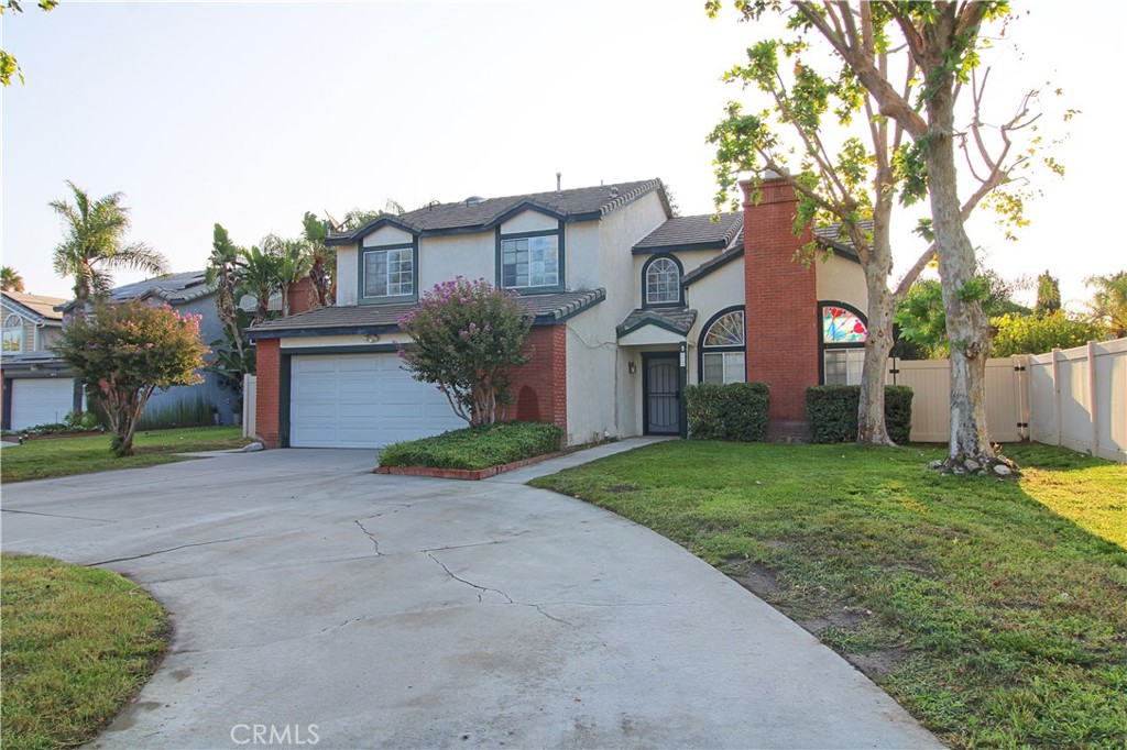 Come home to Redlands and find this centrally located 3 bedroom plus office and 2 1/2 bath home.  Layout boasts 1900 square of friendly living spaces.  Living room with brick fireplace and high ceilings.  Formal dining has built in shelves to display your best collection or suitable for a library/study area.  Recently renovated kitchen features a color popping back splash, solid surface counter tops and stainless steel appliances.  Family room has recessed lighting and french doors that lead to the backyard covered patio.  Spacious upstairs master suite with walk-in closet and dual sinks in bathroom.  Partial floating hallway lends to a bright and open feel. Front circular driveway, two car garage and large rear yard top it all off!