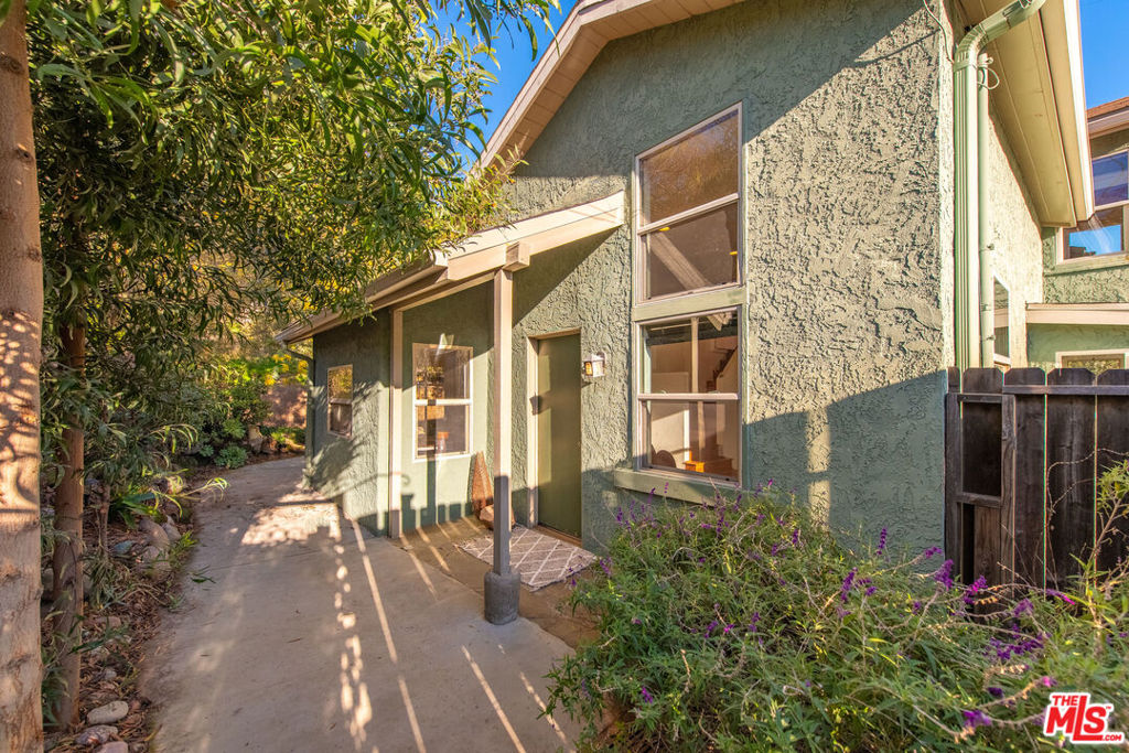 Charming Topanga Cottage Tucked into the heart of Topanga's ideal microclimate, this sweet 2-bedroom, 1-bath cottage offers the best of canyon living peaceful views, coastal breezes, and close proximity to town and the beach. Just moments from beloved local favorites like Mimosa Cafe and the Topanga town center. You will find a cozy and light-filled interior with a nostalgic flair, featuring a retro sunken shower/tub, built in desk and a sweet galley kitchen all add some unique vintage charm. Mature trees line the fully fenced backyard, creating a private oasis perfect for entertaining, gardening, or simply relaxing under the stars. The outdoor shower set up to rinse off after a beach day. A spacious basement offers laundry and generous storage space ideal for surfboards, bikes, or creative projects. This lovingly cottage captures the essence of Topanga