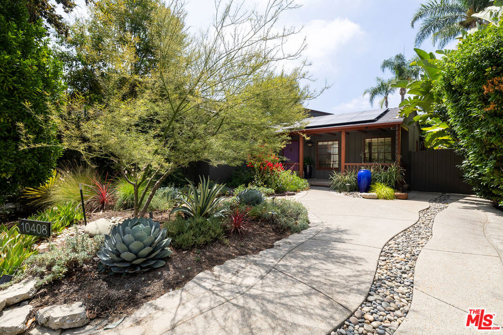 Located in the heart of Toluca Lake, this 1935 home is now available for the first time in nearly forty years. The property has been beautifully and stylishly updated while maintaining its original character. Skylights illuminate the interior year-round and create a seamless flow to the outdoor spaces. The front yard, landscaped with colorful indigenous flora, was designed by John Trager, curator of the Desert Collections at The Huntington Gardens. The back yard, which includes a pool, was designed by renowned landscape architect Mia Lehrer. The property, which runs almost entirely on solar energy, showcases superb design inside and out.