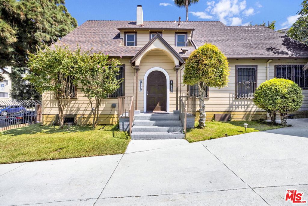 Welcome to 428 S Hoover St. A charming, gated historic residence located Occidental Park in the heart of Los Angeles that has been cared for by the same family since its inception in 1919. This beautifully maintained two-story home features 6 spacious bedrooms, 2 full bathrooms and ample living space. Inside you'll find gleaming hardwood floors, fresh paint, ceiling fans in every room, and central AC and heat on both levels for year-round comfort. The generous kitchen, living, and dining areas are perfect for hosting. Enjoy private outdoor living with front and back yards, plus a long driveway with ample parking and two garages. Located just blocks from Lafayette Park, local restaurants, schools, and public transit, this home offers unbeatable access to the city. Zoned LAR4 in a Transit Priority Area, 428 S Hoover St is a rare opportunity for both end-users and investors. With flexible zoning and a spacious lot, it offers enormous potential. Convert the garages into ADUs, add units, or build a multi-family complex. Citywide programs like CHIP and the Adaptive Reuse Ordinance may provide incentives such as increased density, height, and reduced parking requirements in exchange for affordable housing. Whether you're seeking a well-maintained historic home or a high-demand development site, this versatile property delivers. Buyers to verify all information.