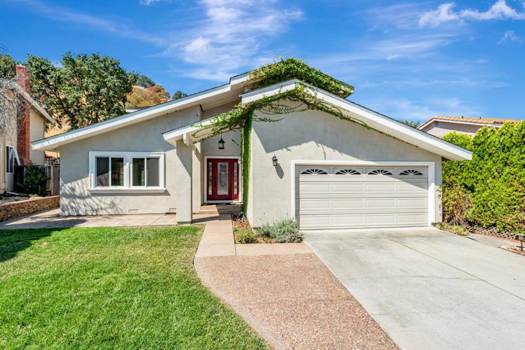 With a beautifully open kitchen, flexible living spaces, and a serene backyard bordered by hillside views, this 3-bedroom, 2.5-bath San Jose home offers a comfortable blend of privacy and practicality. The layout is designed with flow in mind - from the oversized living room with soaring ceilings, to the open-concept kitchen. Rich wood cabinetry and expansive counters anchor the kitchen, offering plenty of space for meal prep and casual dining. The living area offers plenty of room to spread out, a fireplace, and built-in storage, plus access to the yard. Wide windows and glass doors bring in plenty of natural light and frame backyard views. Bedrooms feel calm and private, while bathrooms are thoughtfully spaced and easy to access. The main bathroom feels like a private retreat, offering a soaking tub surrounded by windows, separate vanities, and a large walk-in shower. A dedicated laundry room and a 2-car garage round out the essentials. Living here means enjoying a peaceful residential setting with the convenience of major amenities just minutes away. Oakridge Mall, Target, and Whole Foods are close by, and you're only a few blocks from Martial Cottle Park and quick freeway access. *Fireplace is for decorative use only and cannot be used without consent from Belong.