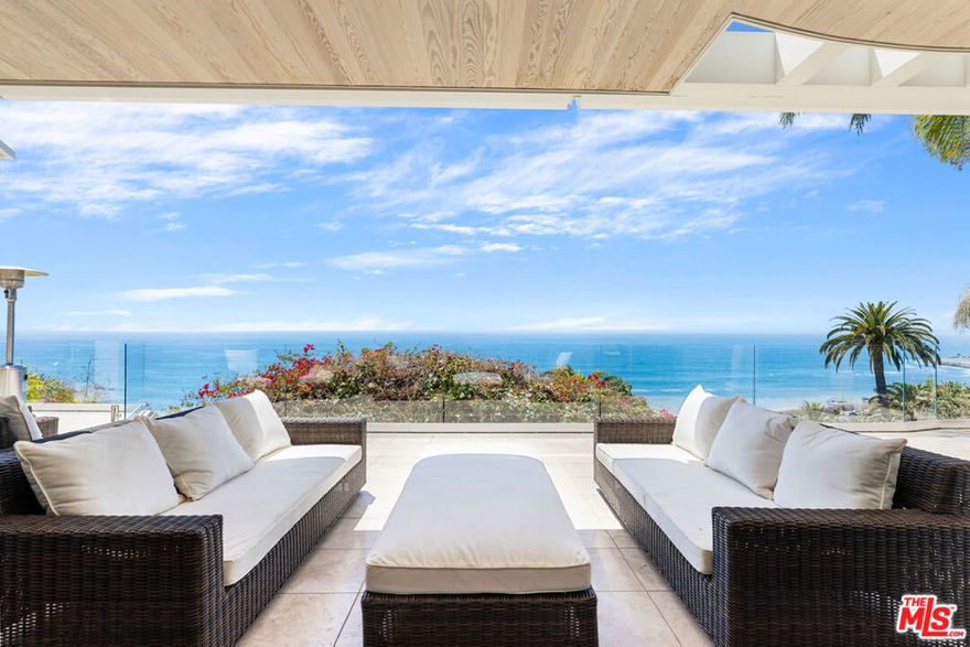 Enjoy sweeping ocean views at this stunning and spacious fully furnished warm contemporary! Immaculate and like new. Perched above the Bel Air Bay Club, this architectural masterpiece offers a private & spacious escape. Floor to ceiling retractable doors in all the public rooms open to the over-sized limestone patio to enjoy head on Ocean views! Enter to find the main level boasts formal living, kitchen, breakfast area, family, formal dining, library/office and powder room. The upper level has four generous en-suites with private decks, and ocean views. Experience the romantic master with white water views, fireplace, 2 walk in closets, and wrap around ocean view balconies! Beyond the pool and yard, you'll find the fully equipped ocean view guest house, with dry sauna, bathroom, and more. Elevator, wine closet, security and sound system, multiple Crestron systems, electronic shades, 3 days/week of house keeping included, along with a house manager, pool service, and gardener. Nothing like it!