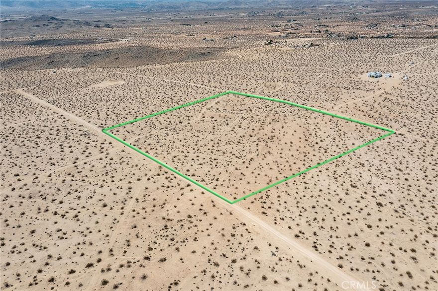 10 BIG ACRES. New water main in street. Glorious views to the south of the ridgelines of Joshua Tree National Park. Wilderness in all directions. Great rural location, yet convenient to town. Plans for architecturally significant houses nearby. Up and coming area of Joshua Tree. NOTE: Green lines demarcating boundaries in pictures are approximate. APN: 0606-321-09