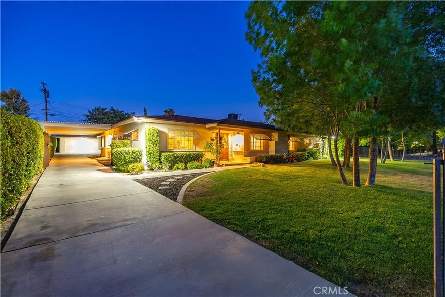 Experience elevated single-story living in this custom West Lancaster estate, perfectly set on a spacious corner lot over one-third of an acre. This beautifully designed 5-bedroom, 3-bath home offers an exceptional blend of comfort, character, and functionality in a quiet, established neighborhood. A fully fenced, landscaped front yard with mature trees welcomes you with privacy and charm. Inside, you'll find a thoughtfully designed layout featuring laminate flooring, designer lighting, custom trim work, and dual living areas—each anchored by a cozy brick fireplace. The formal living room flows to an elegant dining room with original pocket doors, creating a warm and inviting space for gatherings. The updated kitchen is ideal for cooking and entertaining, complete with granite countertops, double ovens, and ample cabinet storage. A spacious bonus room with French doors offers endless flexibility as a game room, creative studio, gym, or home office. The primary suite features a walk-in closet and private ensuite bath, while the additional bedrooms are generously sized, including one large enough to function as a second primary. Two beautifully updated secondary bathrooms add convenience for family or guests. Step outside to your own private retreat—an entertainer's dream with a sparkling pool and spa, multiple covered patios, and a peaceful garden-style side yard. A detached 2-car garage, extended gated driveway, and covered carport provide exceptional parking for RVs, boats, or work vehicles. This rare custom property offers space, style, and lifestyle—all in one.