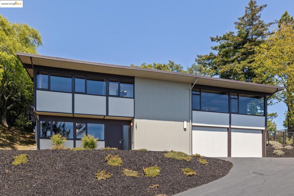 Welcome to 1091 Creston Road, an exceptional opportunity to own a piece of Bay Area architectural history. Perched in the Berkeley Hills with sweeping views of San Francisco, the Bay, and the Golden Gate, this mid-century modern masterpiece was designed by acclaimed architect Roger Lee-an East Bay modernist known for his elegant simplicity and deep connection to nature. Even more special, the home was custom-built for beloved children’s author Beverly Cleary. A quintessential example of Lee’s philosophy, the home features clean lines, floor-to-ceiling glass, warm wood tones, and thoughtful built-ins that blur the line between indoors and out. While the architectural integrity remains intact, the kitchen has been tastefully modernized to meet today’s standards. Reimagined with sleek built-in Fisher & Paykel appliances and an induction cooktop, it blends seamlessly into the home’s aesthetic while offering modern functionality. Set on over one-third of an acre, the property provides privacy, serenity, and the potential for an ADU. This is more than a home, it’s a livable work of art and a once-in-a-lifetime opportunity to own a true Berkeley treasure.