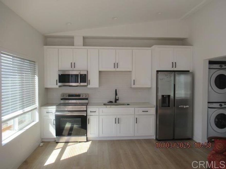 Upstairs gated apartment in a small complex of 4 units.  Newer appliances, flooring, paint, window coverings, refrigerator and a washer and dryer are included, water, sewer and trash are also included in the rent.  Bight and light open living room, spacious unit.