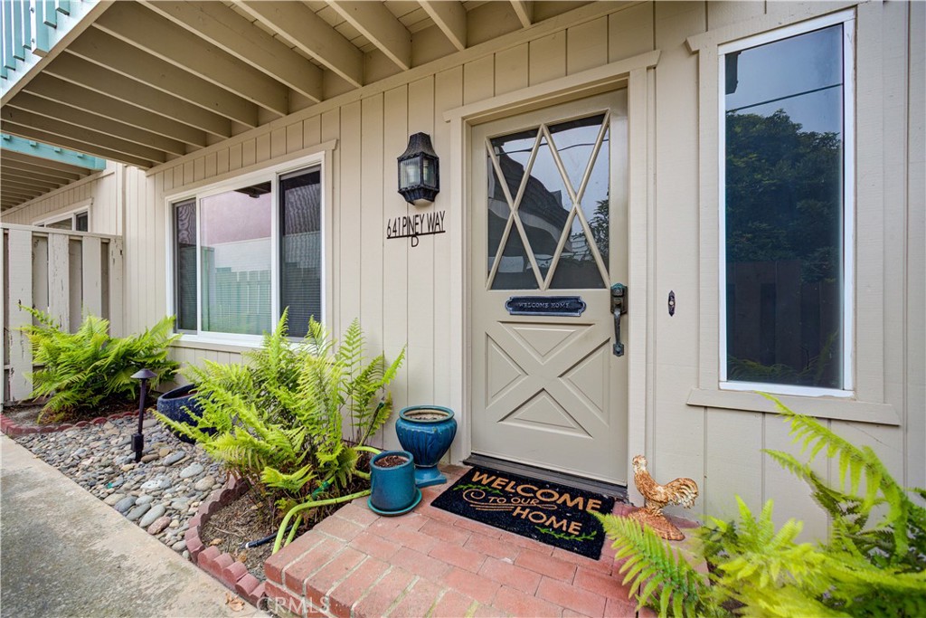 Introducing “Piney Perch,” a charming coastal retreat tucked away in a quiet neighborhood of South-Eastern Morro Bay. Located just one block from the vibrant energy of Morro Bay Boulevard, this 2-bedroom, 2-bathroom home places you moments from artisan coffee shops, unique boutiques, and the beloved weekly farmers market. Thoughtfully designed across two levels, the interior offers a light-filled and welcoming layout ideal for everyday living or a weekend escape. On the entry level, the spacious primary suite is a peaceful haven, featuring a generous picture window, dual closets, and a private ensuite bathroom. This floor also includes a dedicated laundry room with direct access to the attached two-car garage. Upstairs, the open-concept main living area invites connection and comfort, anchored by a striking stone fireplace. At the center of the space, the stair landing subtly divides the room, with a low-profile pony wall providing definition without interrupting flow. Sliding doors open to a private deck perfect for enjoying morning coffee in the ocean breeze or sunset gatherings with friends. The adjoining dining area flows seamlessly into the galley kitchen outfitted with generous cabinetry and a gas range—a perfect space for preparing fresh finds from the local market. The second bedroom and full bath on this level offer flexibility for guests, remote work, or extended stays. Blending laid-back comfort with everyday practicality, “Piney Perch” offers the ideal base to enjoy everything Morro Bay has to offer. From paddleboarding in the bay to strolling the Embarcadero and savoring local cuisine, every day here feels like a vacation. Whether you're searching for your next home, a serene getaway, or an investment opportunity, this gem delivers the essence of Central Coast living. Don’t miss your chance to own a slice of the Central Coast lifestyle! Washer and dryer combo included.