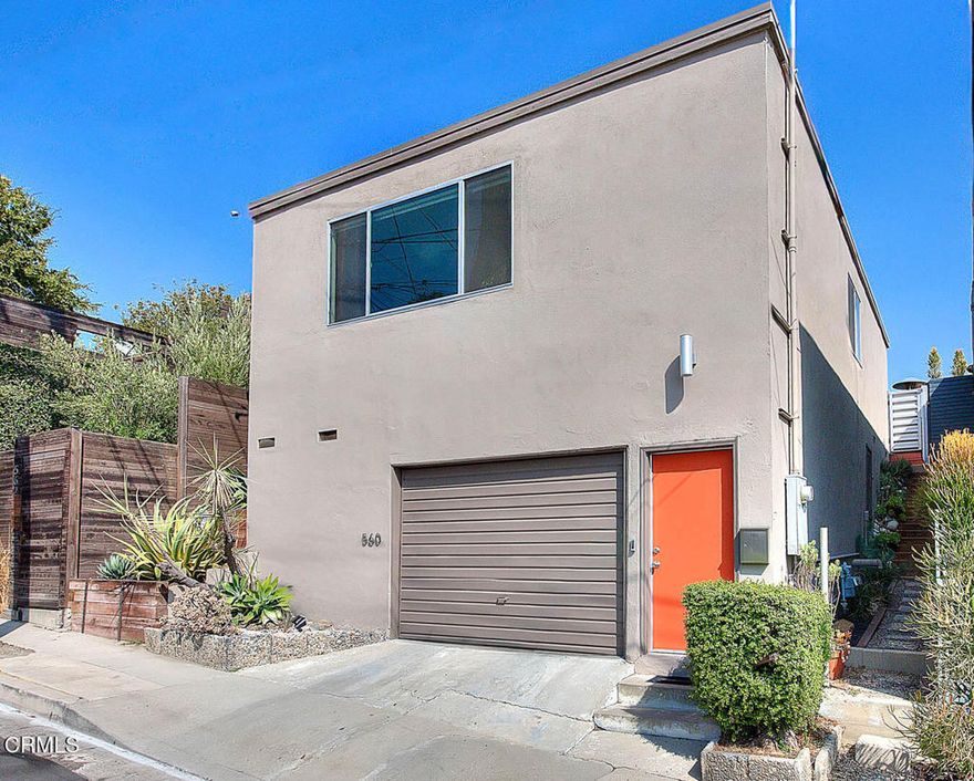 Experience Elevated Mid-Century Living in the Heart of Highland ParkStep into this exquisitely reimagined mid-century residence, a rare architectural gem that blends sophisticated design with effortless Los Angeles living. Perfect as a stylish condo alternative, this home offers breathtaking panoramic views and a seamless indoor-outdoor flow.The entry is framed by artful succulent terraces on either side of the building, leading to a spacious living room where an oversized picture window captures sweeping vistas of downtown Los Angeles and the surrounding hillsides. Natural light and soft breezes cascade through the open-concept layout, uniting the living, dining, and office areas in perfect harmony.The beautifully updated kitchen is a chef's delight, appointed with quartz countertops, Wolf stainless cooktop, double ovens, refrigerator, deep stainless sink, and Hansgrohe fixtures. Every detail has been thoughtfully designed for both beauty and function.The larger bedroom opens through oversized sliding glass doors to a private two-tiered patio--a serene sanctuary for morning coffee or evening gatherings. The unique metal fencing adds a modern-retro flair while ensuring complete privacy. From here, enjoy tranquil mountain and treetop views that transform into a dazzling cityscape at dusk.A secondary bedroom provides additional comfort, while the remodeled bathroom features quartz countertops, Duravit fixtures, designer tile, and premium finishes.Additional highlights include a private one-car garage with secure direct home access, built-in storage, washer and dryer, an upgraded 200-amp electrical panel, and extra storage beneath the home.Designed for both entertaining and relaxation, this property offers the best of modern California living--a quiet urban retreat moments from the vibrant energy of Highland Park's shops, dining, and galleries.From golden sunsets to glittering city lights, this home captures the timeless allure of mid-century architecture and the soul of Los Angeles living.