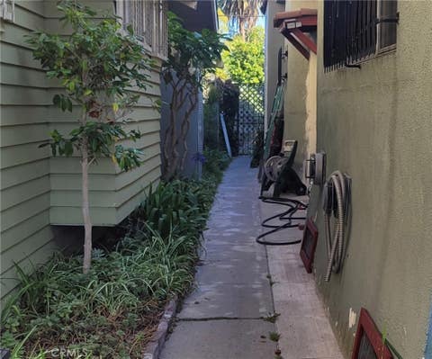 Photo of 1630 MIDDLETON Place, Los Angeles, CA 90062 (MLS # GD26161545)
