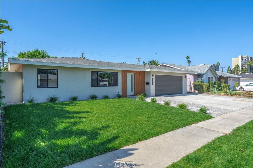 Welcome to this beautifully remodeled 3-bedroom, 2-bathroom turnkey home, where contemporary design harmoniously melds with traditional European influences. Every corner of this residence is a testament to clean lines and an emphasis on both functionality and comfort, highlighted by luxurious vinyl flooring that flows seamlessly throughout. Step into the stunning modern kitchen, a culinary haven featuring abundant counter and cupboard space adorned with elegant quartz countertops and sophisticated cabinetry. The inviting serve-over bar provides a perfect spot for casual dining, making it an ideal space for entertaining. The kitchen comes fully equipped with brand-new stainless steel appliances, ensuring a delightful cooking experience. Retreat to the primary suite, which boasts its own en suite bathroom. This serene oasis includes a floating vanity and a lavish walk-in shower, designed to provide a spa-like experience. A convenient sliding door offers direct access from the bedroom to the backyard, allowing for effortless outdoor enjoyment. The secondary bathroom is equally impressive, showcasing modern fixtures in a stylish full tub and shower combination. The home features two additional secondary bedrooms, providing ample space for family or guests, as well as versatile living options. Additional upgrades include new electrical and plumbing systems throughout, ensuring peace of mind for years to come. Nestled on a generous lot of over 7,800 square feet, the property is framed by newly laid sod, complete with a state-of-the-art sprinkler system equipped with timers. The expansive backyard is a paradise for entertaining, showcasing a blend of spacious hardscaping and lush soft landscaping, complemented by mature foliage and a thriving vegetable garden that invites you to embrace the joys of outdoor living. Conveniently located near esteemed schools, markets, and a vibrant array of shopping and dining options, this property offers easy access to Disneyland and major freeways (22, 5, 57, and 10), and the lively Little Saigon area, making it a prime spot for both work and play.