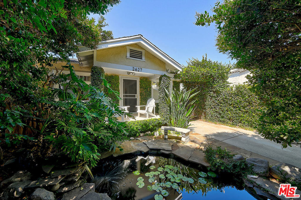 Are you debating whether to buy or not to buy? This darling home will steal your heart and give you plenty of reasons to buy now. This vintage-charmed is tucked in the middle of the hot, eclectic, super-developing West Adams neighborhood. The house is sequestered behind lush landscape and as you step into the driveway you are greeted by a sense of peace and enchantment brought by a gorgeous fish pond! Walk in, and the spacious living room welcomes you with a fireplace that boasts rare, coveted, tiles. Bright, natural light shines with multiple windows and mini skylights throughout. This 3 bedroom, 1.5 bath, nearly 1,200 sq. ft. property is ready for your personal touches to become your dream home. In the backyard, a deck and mature fruit and bamboo trees create a private oasis, perfect for entertaining or to simply relax. The one car garage could also be turned perfectly into an office or studio. All the appliances are included as well as tv, outdoor furniture and a leather sofa. The seller had done upgrades to the foundation. You are steps away from the most trendy restaurants in Los Angeles: 'Mian', 'Mizlala', 'Alta'...to name a few. Less than a mile from Whole Foods! This is one of the most sought after locations in the Los Angeles real estate market, close to Culver City, world-class entertainment and critically acclaimed restaurants of DTLA, and a short drive to Santa Monica and Venice Beach. Welcome HOME