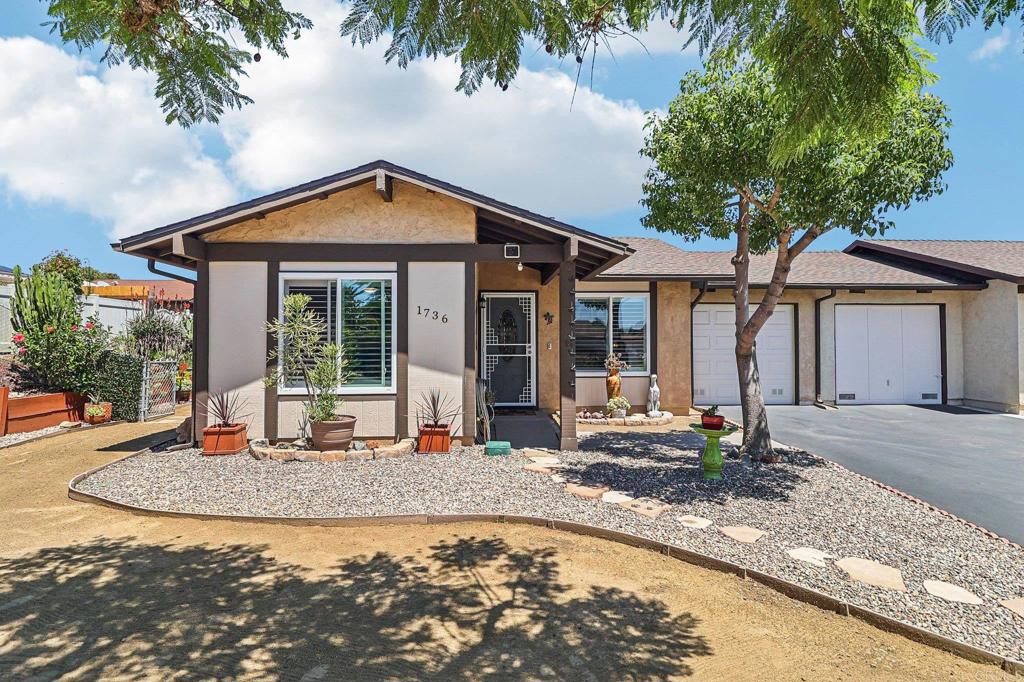 Nestled in the heart of Peacock Hills, one of Oceanside's most coveted 55+ communities, this charming twin home offers an unparalleled blend of comfort and convenience, just minutes from vibrant shopping, pristine beaches, and easy freeway access. The home boasts a fresh, modern aesthetic with a newly replaced roof, sleek porcelain tile flooring throughout, and energy-efficient double-pane windows that bathe the interior in natural light. The inviting living room and master bedroom feature hurricane shutters for added peace of mind, while new electrical ceiling outlets allow for the installation of ceiling fans to keep the space cool and airy. The updated kitchen dazzles with a mosaic glass backsplash and new ceiling lights, creating a perfect setting for culinary creations. Both bedrooms showcase plush new carpeting, and the entire home is equipped with a state-of-the-art HVAC system for year-round comfort. Outside, a newly replaced driveway leads to a stylish new front door and security door, while the sunrooms are enhanced with fresh screen doors, ideal for enjoying the coastal breeze. The outdoor patio, complete with a charming gazebo tent, offers a delightful space for residents to set up a barbecue or create their own personalized outdoor oasis, perfect for entertaining or relaxing in the mild Oceanside climate. With wide streets, ample guest parking, and an incredibly low HOA fee of just $11 with no special assessments, this Peacock Hills gem is a rare find in a community designed for effortless, vibrant living.