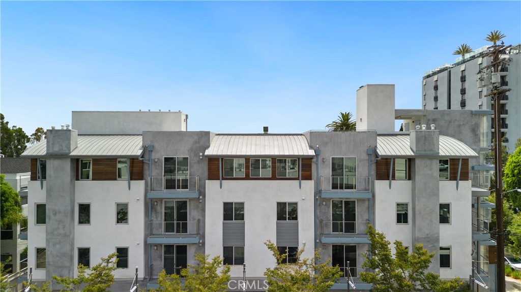 Welcome to The Larrabee - a stunning contemporary architectural masterpiece! You'll be wowed by these luxurious three and three+den bedroom apartment suites featuring separate entrances, magnificent southern views of the city lights, and framed floor-to-ceiling windows. The building is also equipped with an elevator for your convenience. These spacious apartment suites are all on one level except for the den unit. The finishes are top-notch and include Fleetwood sliding doors, which complement the gorgeous hardwood floors and impressive 23-foot high ceilings. The living room features a cozy fireplace and large windows that allow natural light to pour in and offer breathtaking views of the city skyline. The modern chef's kitchen is equipped with top-of-the-line appliances, Silestone counters, and a center island, perfect for hosting gatherings with friends and family. The large primary suite includes a custom walk-in closet, a sleek bathroom, and a fireplace. Each bedroom suite boasts an expansive walk-in closet custom-fitted with organizers, ensuring you have ample storage space. Entertain guests or unwind in complete relaxation on the massive private rooftop terrace, offering 360-degree panoramic views of downtown LA, the Hollywood Hills, and the ocean. You'll also appreciate the two side-by-side gated parking spaces, storage, custom showers with bench seating and frameless shower doors, ample closets, a Lobby Intercom system with App, and an in-unit washer and dryer. Conveniently located just steps away from the famous Sunset Strip, The Larrabee offers a prime location for the best restaurants, clubs, cafes, and shops that Sunset Boulevard has to offer. Lastly, the explosive head-on views of Downtown, Hollywood Hills, the Griffith Observatory, and the gorgeous San Gabriel Mountains will take your breath away. Don't miss your chance to live in luxury and style at The Larrabee! Layouts and views may vary. Unfurnished-staged property. Some floor plans vary.