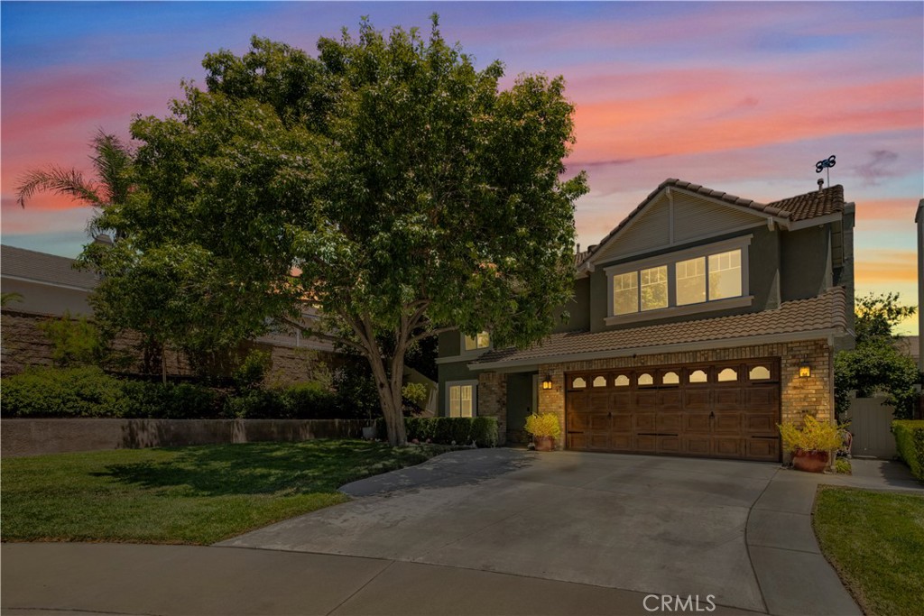 Tucked at the end of a quiet cul-de-sac, this beautifully upgraded 4-bedroom plus loft, 3-bathroom home offers the space, comfort, and lifestyle you’ve been looking for. Imagine hosting friends and family in your formal living and dining room, enjoying morning coffee in the cozy breakfast nook, and preparing meals in the spacious kitchen with ample counter space and a walk-in pantry. The open-concept family room with a stacked stone fireplace and slider to the backyard makes everyday living and entertaining seamless. With a downstairs bedroom and full bath—perfect for guests or a home office—and a full laundry room with extra storage, the layout is designed for real-life function. Upstairs, unwind in your oversized primary suite with a double-door entry, its own fireplace, a spa-like bathroom with double sinks, separate tub and shower, and one of the largest walk-in closets you’ve ever seen. Let the stress of the day melt away in your private backyard retreat, complete with an above-ground spa, outdoor wood-burning fireplace, and peaceful fountain surrounded by mature landscaping. With recent upgrades like a 2-year-old HVAC and a brand-new water heater, plus no HOA, low taxes, and a central location near freeways, top schools, shopping, and hiking trails—this home truly has it all.