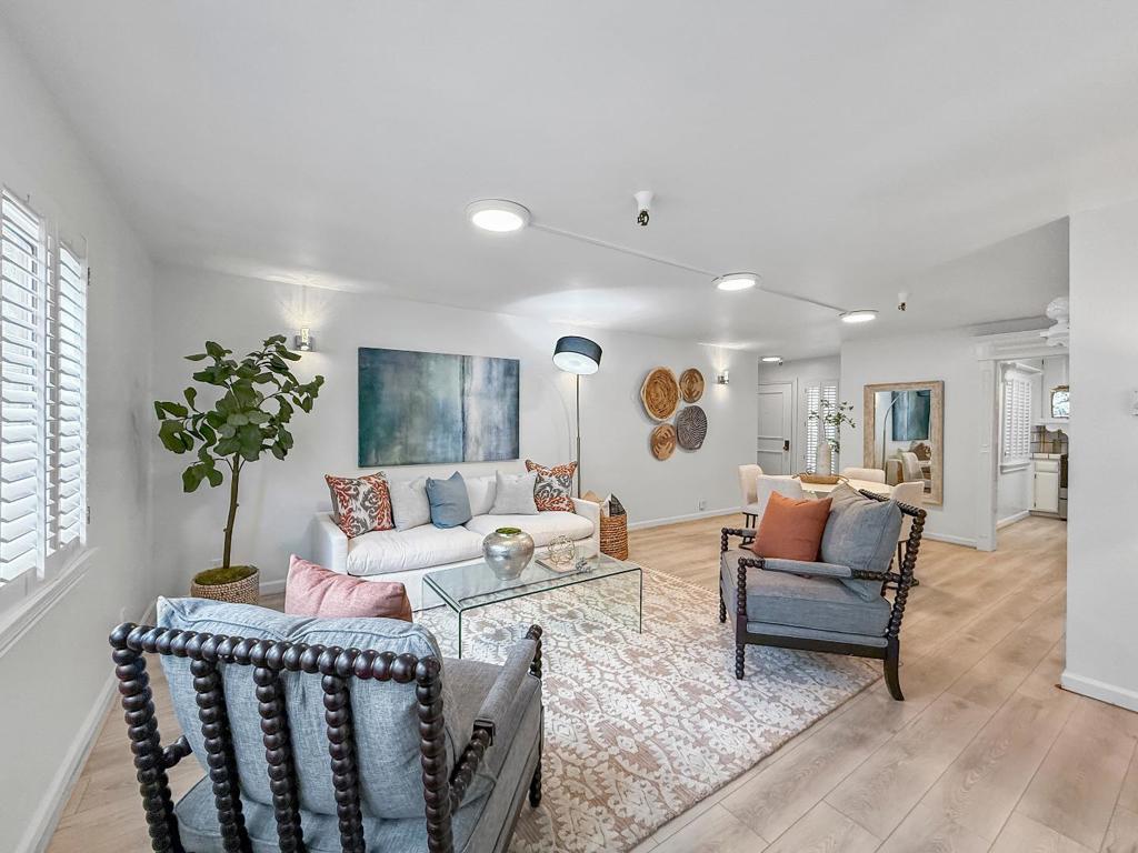 Welcome home to this secure, inviting ground floor end-unit condo in the tranquil Los Gatos Commons retirement community, perfectly designed for comfort & an active lifestyle. Situated just moments from downtown LG, this charming residence features bright, updated interiors w/LVP flooring & fresh paint, creating a warm & welcoming atmosphere. The spacious living & dining areas provide an ideal setting for intimate gatherings or elegant entertaining, while the well-appointed kitchen complete w/stainless steel appliances & ample cabinetry ensures everyday convenience. The primary bedroom offers a peaceful retreat w/generous closet & sliding door access to an enclosed patio, while the tastefully updated en-suite bathroom & additional guest bedroom enhance both privacy & functionality. Outdoors, a generous patio & dedicated storage area expand your living space & a private gate to adjacent guest parking adds convenience. With an array of amenities designed for active retirees including a clubhouse, swimming pool & spa, exercise facility, walking paths, secure common parking plus HOA coverage for water, garbage, cable/internet, and close proximity to shopping, dining, and the scenic Los Gatos Creek Trail, this condo truly offers a harmonious blend of comfort, security & lifestyle.
