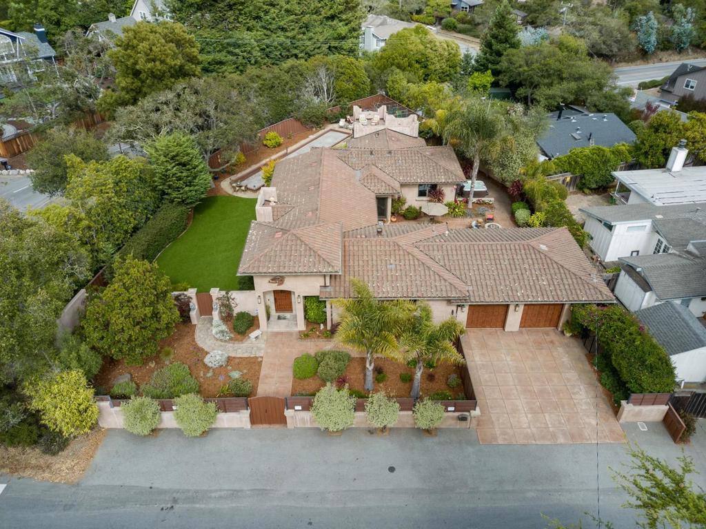 Enjoy the La Selva Beach lifestyle in this fabulous two bedroom, two bath home with separate office/den that could be used as a third bedroom. Built in 2010 with a great 2,605 square foot floor plan. Gourmet kitchen with a big island, custom cabinetry, high-end Wolf gas range and refrigerator appliances. Hardwood floors throughout the home, two fireplaces, and a wine bar. Master bedroom features a gas fireplace, en-suite bath with double sinks, luxurius shower and double walk in closets. Large double lot offers a perfect setting for a relaxing retreat with a fire pit and hot tub. Separate outdoor shower, spiral staircase leading to a private rooftop terrace. A great outdoor kitchen for family cookouts and a Bocce ball court and garden area for family gatherings. Great warm and inviting house to make your new home.