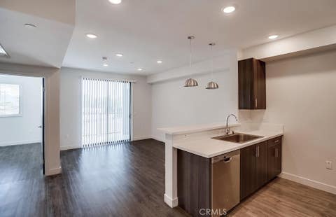 Photo of 6015 Woodman Avenue #201, Van Nuys, CA 91401 (MLS # SR26132041)