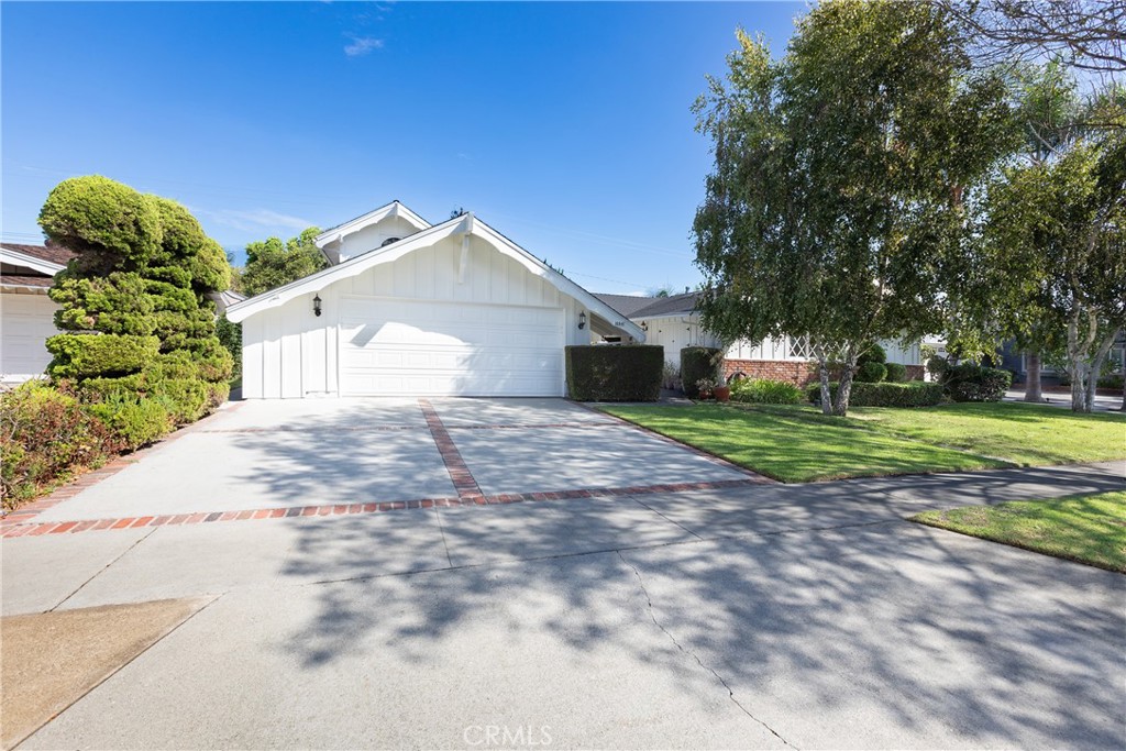 Desirable Garden Grove Neighborhood. A 3 bedroom/2 bath home that sits on a large lot. This house is a custom home with beautiful cedar walls, built in shelves, a beautiful loft with a balcony, a country kitchen, spacious dining area that has beautiful French wood doors leading out to the lushes, landscaped yard. The kitchen is built with a large pantry, lots of counter space with cabinets, butcher block counter tops. Lots of potential to make a big great room. The living room is situated in the front of the house with a large window looking out onto the mature shady trees. The main bathroom is decorated with an old clawfoot soaking bathtub as well as a pull chain toilet. The primary room has a large closet along with a sitting area. The sizeable brick patio has ceiling fans perfect for lounging or entertaining. The park like backyard with an array of mature trees make this a bird haven. There is a free-standing workshop in the back yard which can be used for numerous things. It has a pull-down ladder to get up into the loft which could be used for storage or nothing your imagination can't figure out.