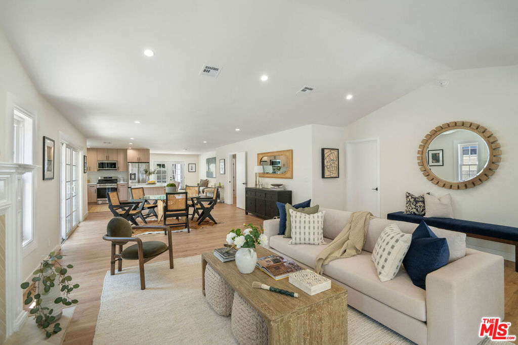 Welcome to a beautifully updated single-family home in the heart of Larchmont Village, offering 5 bedrooms and 4 bathrooms thoughtfully designed across approximately 2,600 sq. ft. of living space. Garage/ADU Included! Step through a welcoming front porch into a spacious living area, recessed lighting, and a decorative tiled fireplace. The open layout flows seamlessly into a dining space and a remodeled kitchen with stainless steel appliances, ample cabinetry, and a bright, modern feel. A garage conversion provides an additional bedroom and bathroom ideal as a guest retreat, office, or studio. Outdoor living shines with a low-maintenance turfed yard and shaded patio designed for gatherings and relaxation. The property is fully fenced with gated access and a large driveway offering generous parking options. Centrally located, this home is minutes from the farmers' market, dining, and shopping in Larchmont Village, as well as nearby parks and vibrant neighborhoods such as Hollywood and Koreatown. Approximate square footage. Tenant to verify all information independently. Pets allowed. Tenant responsible for all utilities. Gated parking, in-unit laundry, and private yard included.