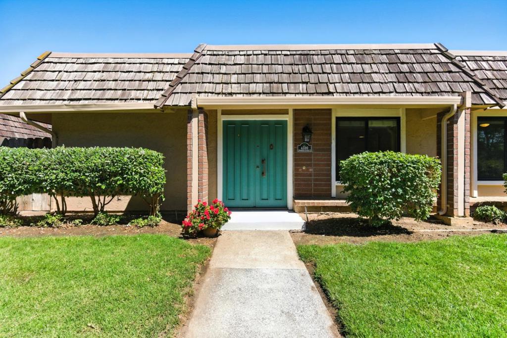 This beautifully updated 3-bedroom, 2-bathroom, 1,104 sq. ft. one-story,corner-unit offers both privacy and modern comforts with only one shared wall. Step through the double front doors into a bright and airy living space featuring vaulted ceilings in the living and dining areas. The kitchen boasts a stylish peninsula with a breakfast bar, stainless steel appliances, a double-bowl sink, recessed lighting, and ample counter space. The primary suite includes a spacious closet and an en-suite bathroom with a large walk-in shower. The home features wood laminate flooring, a new air conditioning unit, and dual-pane windows for energy efficiency. Enjoy the large private patio with an automatic drip system, flora, and a veggie garden, which creates a seamless connection between the home and the two-car garage. Just beyond the entrance, a lush, open grass area with mature trees provides a serene outdoor setting. Conveniently located near shopping, grocery stores, restaurants, a gym, and Leif Erikson Park, with easy access to Highway 87 and Almaden Expressway for a smooth commute. Don't miss this well-appointed home in a prime location! HOA is currently replacing the wood shingles throughout the complex.