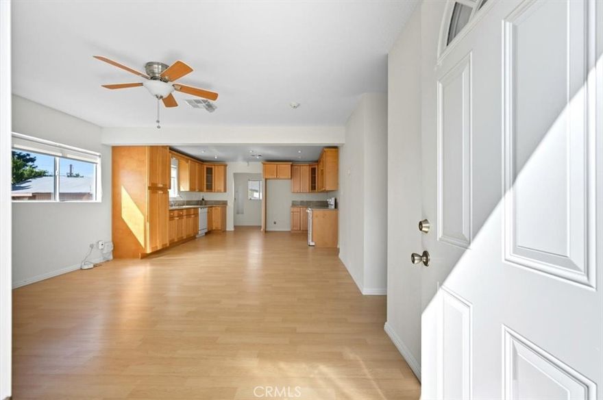 Welcome home to this beautifully maintained 2-bedroom, 1¼-bath residence in the heart of Upland. As you approach from 5th Avenue, you’ll be greeted by lush fruit trees—including avocado and grapefruit—framing the inviting entry. Step inside to discover a bright, open floor plan freshly painted throughout. The spacious living/family room features newer flooring and flows seamlessly into the updated kitchen, complete with modern cabinetry, a clean stove, dishwasher, and charming farm sink. 

Just off the kitchen, you’ll find a convenient laundry/mud room with an adjoining half bath. From there, step out to the side yard offering generous parking space and access to the two-car garage with an attached storage area. 

With over 1,000 sq. ft. of living space (per assessor) and a nearly 5,500 sq. ft. lot, there’s plenty of room to relax and entertain family and friends. Ideally located near churches, schools, restaurants, shopping, and major freeways, this home offers both comfort and convenience.