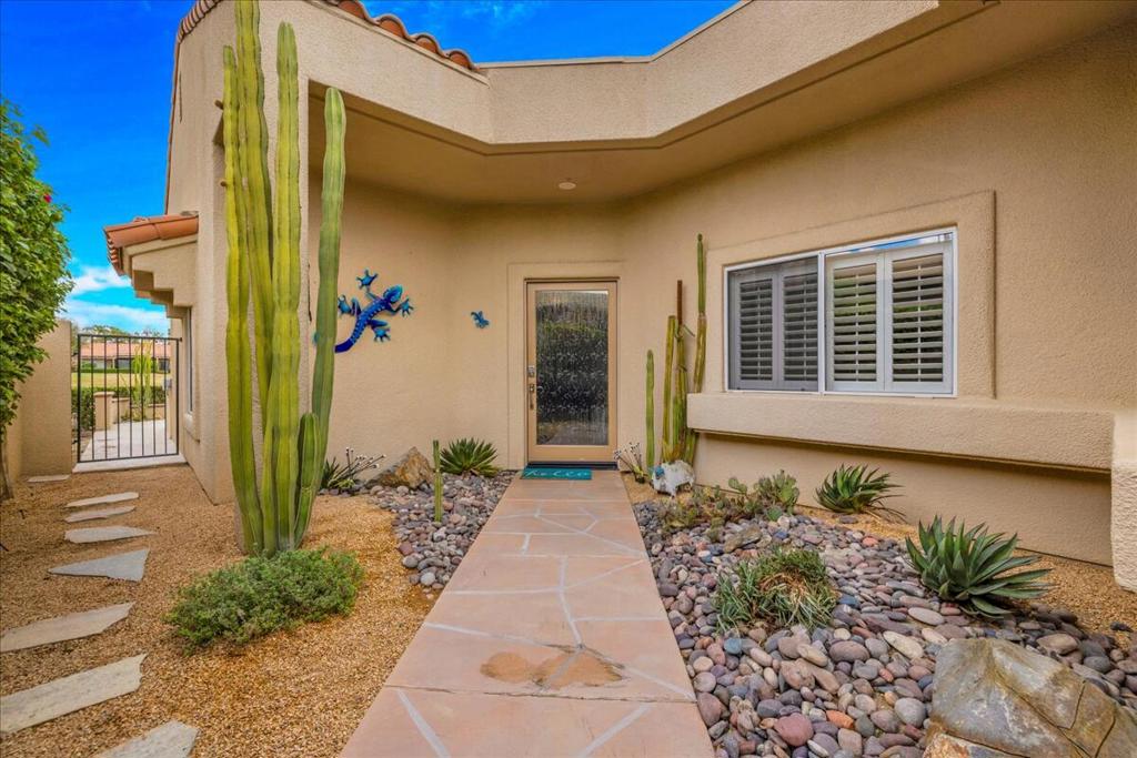 (Golf Course is currently undergoing annual re-seeding) Beautiful Lakefront & Golf Course Views! Solar-Powered 4 Bedroom / 3 Bath Home on the 5th Hole of the Westin Pete Dye Course. (Fee Simple - You Own the Land). Enjoy resort-style living with breathtaking panoramic views of the lake, mountains, and golf course. This beautifully upgraded home features a private gated courtyard with elegant hard and soft landscaping and a custom glass entry door that sets the tone for the attention to detail throughout. There is an expanded custom back patio with Mountain. Lake and Golf Course views. The chef's kitchen showcases frameless picture windows that perfectly frame the view, Madre Perla Quartzsite countertops, tile backsplash, white cabinetry, and a full suite of KitchenAid stainless appliances including a 5-burner gas range and microwave. There's an abundance of counter and prep space--ideal for entertaining. The home is enhanced with Italian tile flooring, custom built-in cabinetry with glass shelving, and a gas fireplace in the living room. The Primary Suite offers a luxurious retreat with a custom double-sink vanity, quartz counters, hand-painted tiles, and a glass block shower. A separate Casita serves as the fourth bedroom, complete with a private entrance and south-facing views--perfect for guests or an office. Single Loaded street adds privacy and the HOA includes: Roof maintenance, trash, cable, Internet, guard-gated security, and access to 3 heated community pools and spas.