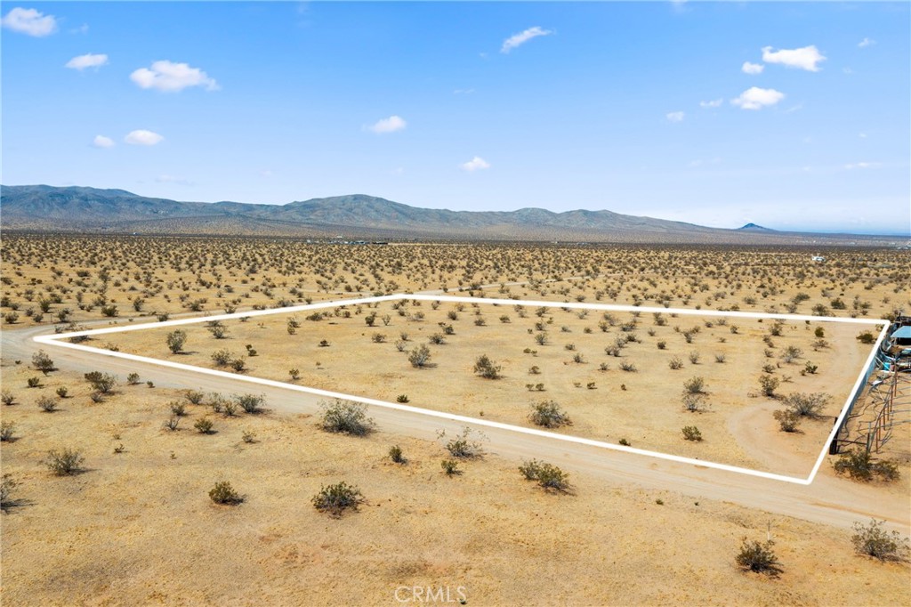Opportunity is knocking with this prime piece of land—APN#0470-202-09—perfectly situated near an already developed residential area full of charm and convenience. Sitting on a generous 88,426 square feet—just over 2 acres—this flat, build-ready lot offers a blank canvas for your dream home or next investment. Imagine creating something special just minutes from established track homes, local dining spots, and shopping centers—everything you need is right around the corner, yet you still get the space and flexibility to build exactly what you want. Whether you're a developer or someone looking to design the perfect custom home, this is a rare find in a growing area. Don’t miss out on the potential waiting here!