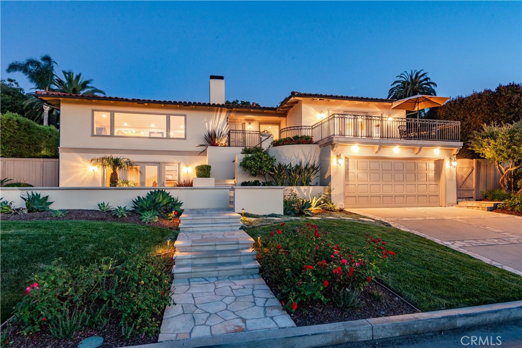 Located on one of Palos Verdes Estates’ most desirable and flat cul-de-sac streets, this exquisite home enjoys expansive ocean and Queen’s Necklace views. Set on a famous, palm tree-lined street, the property features lush landscaping, striking curb appeal, and classic Palos Verdes stone accents. Taken to the studs in 2005, no detail was overlooked in this beautiful remodel. The thoughtful floor plan encourages an indoor/outdoor lifestyle—perfect for both relaxing and entertaining. The inviting living room centers around a beautiful fireplace and oversized picture windows to enjoy the views. The formal dining room is ideal for gatherings, while the gourmet kitchen is a chef’s dream. The tranquil patio, complete with outdoor fireplace and a built-in BBQ, offers a peaceful place to unwind or host guests. The primary suite is a private retreat with a luxurious en-suite bath and a spacious patio overlooking the coastline. Downstairs, a generous family room with fireplace and French doors opens to a charming PV stone patio, perfect for al fresco living. Set in a picturesque neighborhood close to award-winning schools, this exceptional home on Rincon Lane truly has it all.
