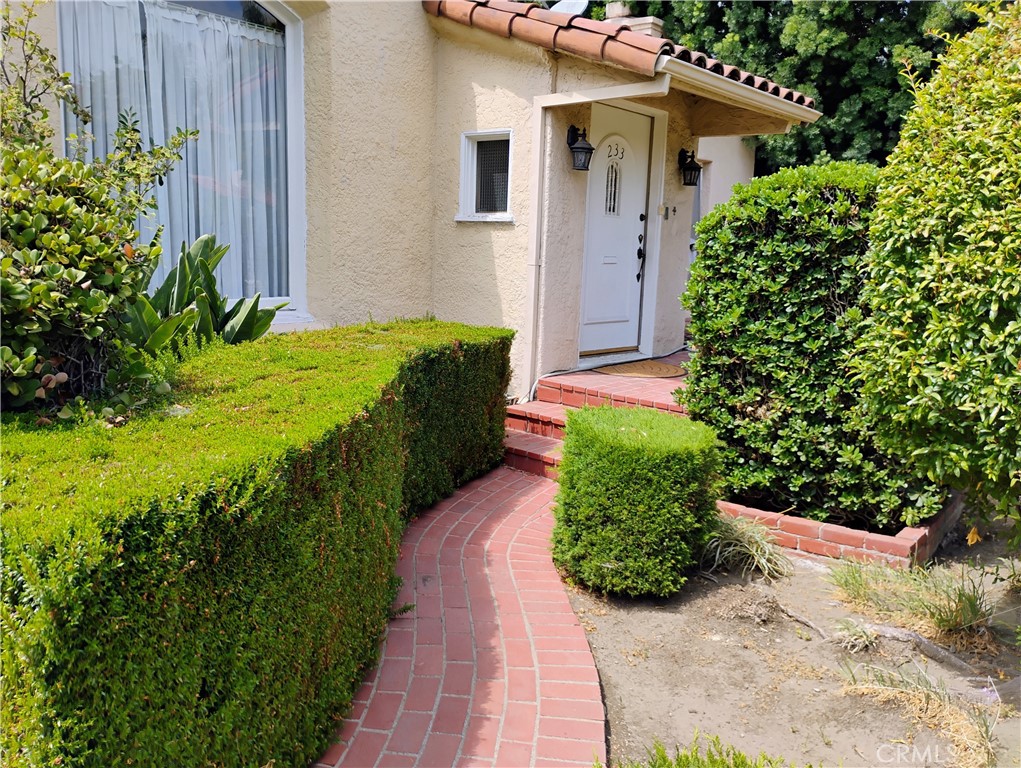 Offering a distinctive blend of character, comfort, and prime location as well as being a unique opportunity to reside in a piece of Beverly Hills history,
while nestled into a coveted Beverly Hills location and perfectly situated near the vibrant intersection of Wilshire and Robertson. This enchanting 3-bedroom, 1.75-bathroom home offers approximately 1,750 square feet of unique living space, blending historic elegance with comfortable functionality.
Built in 1929, the home boasts a captivating Spanish-style exterior characterized by its distinctive red tile roof and charming original windows, evoking the timeless allure of classic California architecture. Step inside to an interior that surprises and delights with its authentic Art Deco styling, featuring period details that transport you to a bygone era of glamour and sophistication.
Beyond the interior, you'll find a spacious outdoor living space, perfect for al fresco dining, entertaining, or simply enjoying the Southern California sunshine in privacy. Adding to the home's versatility is a separate rear unit, ideal for use as a dedicated home office, a serene meditation retreat, or an inspiring creative studio.
This home is offered unfurnished, but for an effortless move-in, it can be rented with thoughtfully curated furnishings already in place, through arrangement with the landlord. Come make this home, full of Hollywood grandeur, your new place to call home