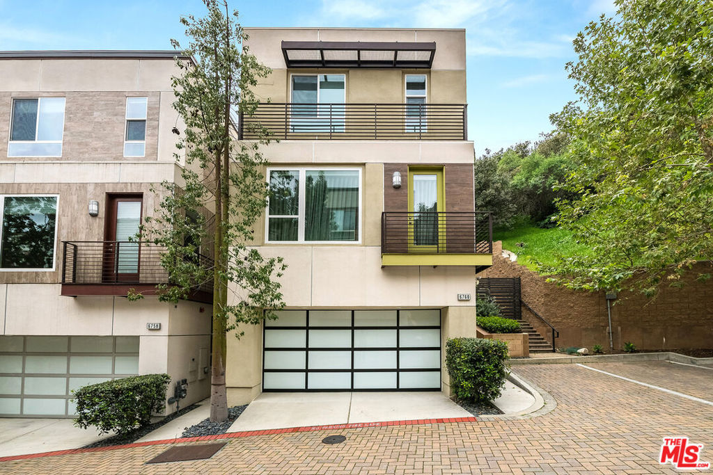 Incredible value for the most desirable and highly coveted unit in the complex! Located on upper Gill Way - in the most quiet and peaceful section of the community, this corner unit features maximum privacy with no neighbor on the Western side. Encapsulated by lush greenery and nature, enjoy extra large patio space only afforded to the corner unit which includes the private side entrance for even more outdoor space and beautiful outdoor dining. Abundant natural light pours in through energy-efficient L-E windows, accentuating a modern and tasteful color scheme throughout. The open-concept kitchen is outfitted with sleek custom cabinetry, durable Caesarstone countertops, and the full accompaniment of stainless steel, energy-saving appliances. Spa-inspired bathrooms showcase imported vanities, luxurious surfaces, elegant Moen fixtures, and water-saving features. Built with sustainability in mind, this home includes programmable thermostat, high-efficiency lighting, tankless water heater, insulated air ducts, and prewiring for 210V hybrid vehicle charging. Ideally and conveniently located with easy access to the Hollywood Bowl, Runyon Canyon, Universal Studios, and the vibrant heart of downtown LA. A true must see property at an exceptional value!!