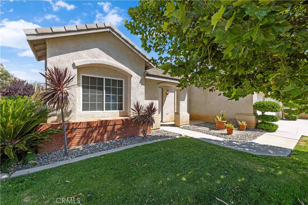 Charming West Lancaster Gem in a Desirable Walk-Friendly Community! NEW HVAC & ROOF! Welcome to this beautifully updated single-story home located in one of West Lancaster's most sought-after neighborhoods—an area known for its peaceful atmosphere and outdoor recreation. Residents here enjoy walking, biking, and fishing along the nearby California Aqueduct, just minutes from your doorstep. Built in 1993, this spacious home offers vaulted ceilings and a versatile layout with three generous bedrooms, two full bathrooms, plus a bonus room—perfect as a home office, den, or potential 4th bedroom. The bright and open family room with a cozy fireplace flows seamlessly into the updated kitchen, featuring granite countertops, a stylish tile backsplash, and ample cabinetry. A separate formal living and dining area provides an elegant space for entertaining. Freshly painted throughout, this home also features a new roof and a new HVAC system for year-round comfort. The indoor laundry room, complete with washer and dryer, adds everyday convenience. Retreat to the spacious master suite, which includes a luxurious bathroom with double sinks, a walk-in shower, and a separate soaking tub—your personal spa escape. Enjoy outdoor living with lush front and rear landscaping, automatic sprinklers, and a covered patio perfect for summer barbecues or relaxing in the shade. Don't miss this opportunity to own a move-in ready home in a vibrant, family-friendly neighborhood!