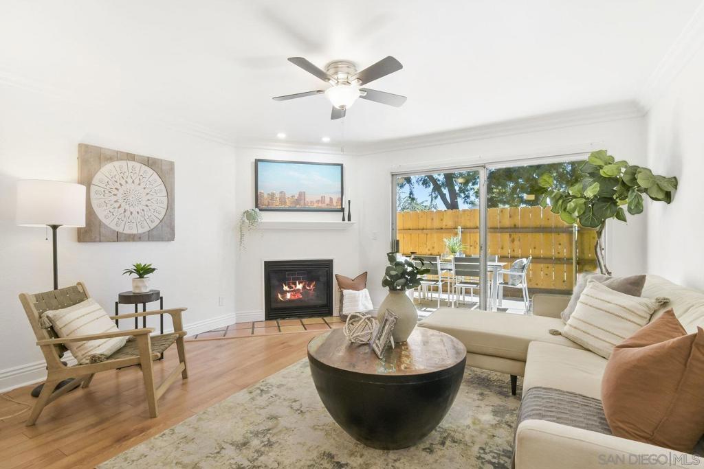 This VA approved two-level townhouse style condo is located in the heart of the vibrant College Area and Rolando Village., Freshly painted, this spacious 2-bedroom, 1.5-bath home offers 900 sq ft of comfortable living across two levels, featuring modern LVP flooring throughout (with easy-care tile in the kitchen and baths), and a cozy fireplace for relaxing evenings. Enjoy in-unit laundry, ceiling fans in each room, and an inviting exclusive patio perfect for morning coffee or entertaining guests. Upstairs, one bedroom opens onto a private balcony overlooking the park across the street, providing a peaceful retreat. Separated by a generous full bathroom is the spacious second bedroom, making for the perfect roommate or small family layout. The home includes covered assigned parking plus additional storage. Just minutes from SDSU and easy freeway access. The area offers excellent walkability with a Walk Score of 84, abundant dining options including Terra American Bistro, Woodstock's Pizza, and diverse cuisine at Campus Plaza. Families will appreciate nearby Clay Elementary School and recreational facilities at the Ray & Joan Kroc Center. —This home delivers both convenience and charm in one of San Diego’s most desirable communities. Don’t miss this opportunity in a sought-after Mid City location.